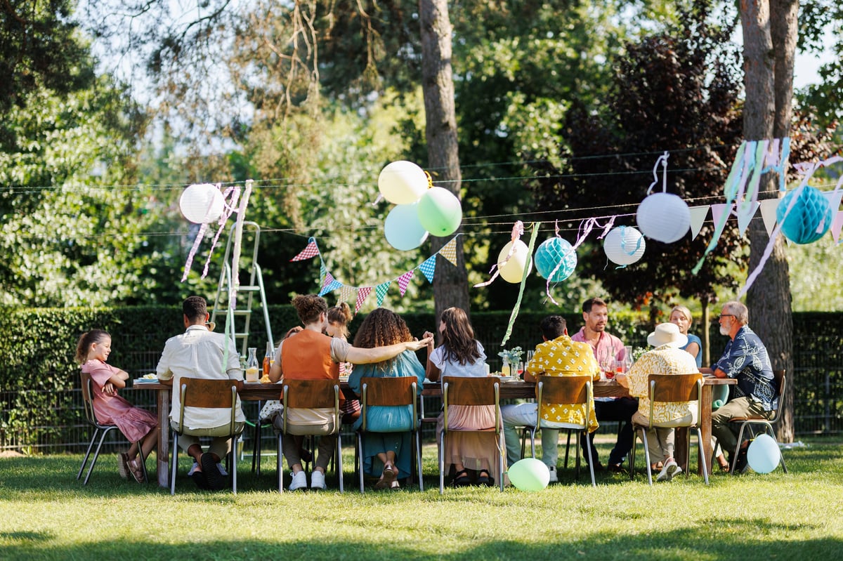 Family and friends enjoying a garden party at Jardín Chris